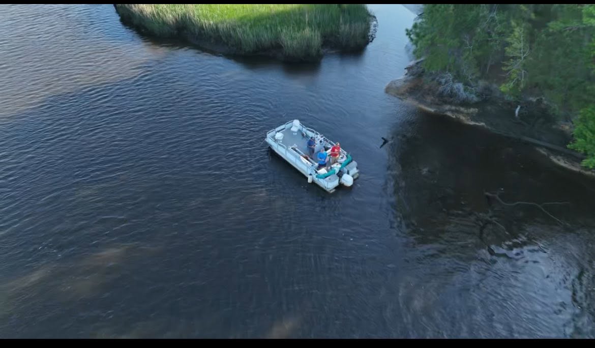 Gator Hole charter boat traveling through Town Creek